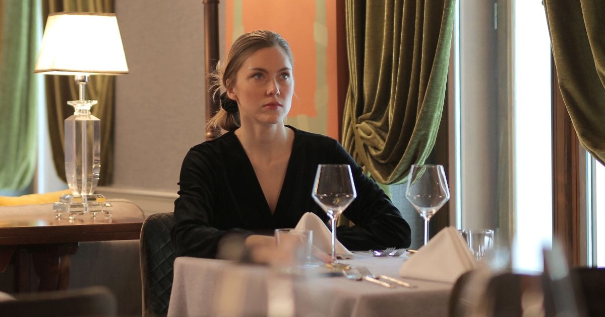 She thought being a wedding plus-one meant dinner too — until the couple's family and friends entered the feast and left her waiting in the hall