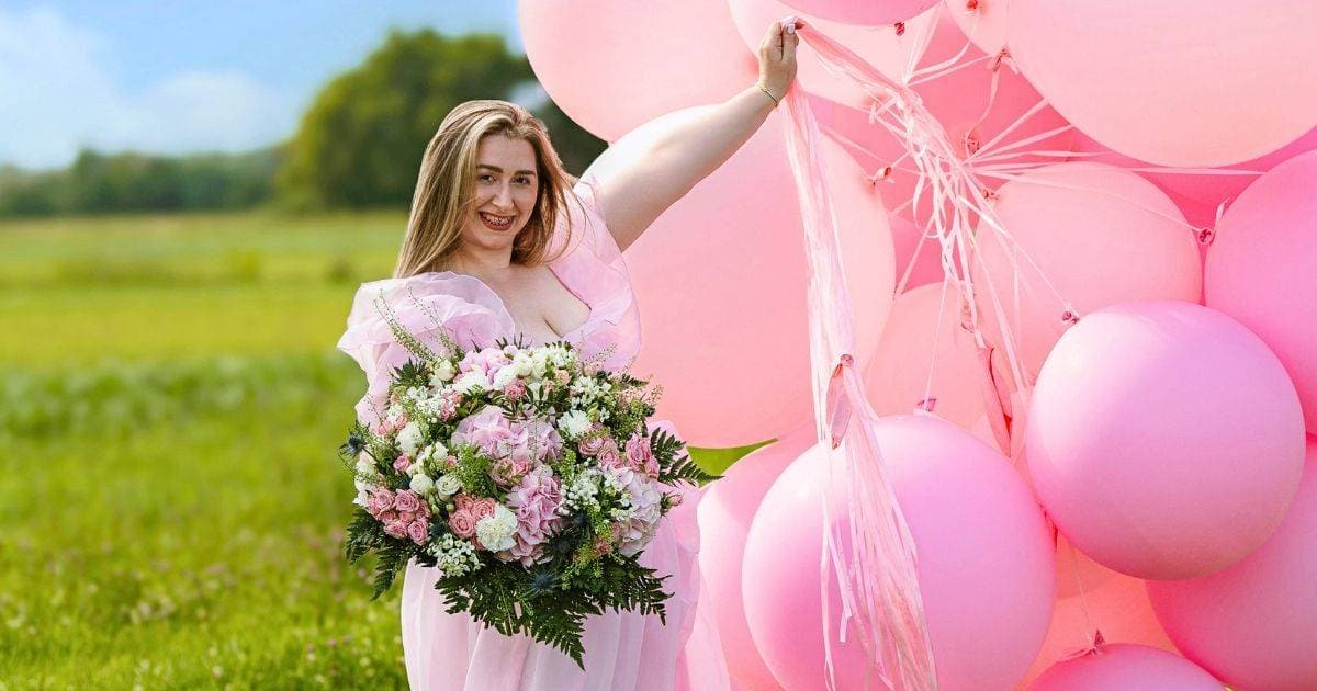 Giant balloons lift bride off her feet and drag her toward a seawall. Photographer rushes to save her