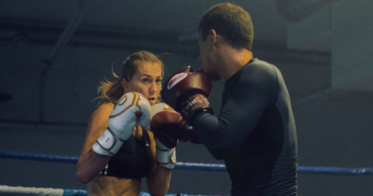 Bride wore a gown and boxing gloves to her wedding. Then the groom stepped into the ring