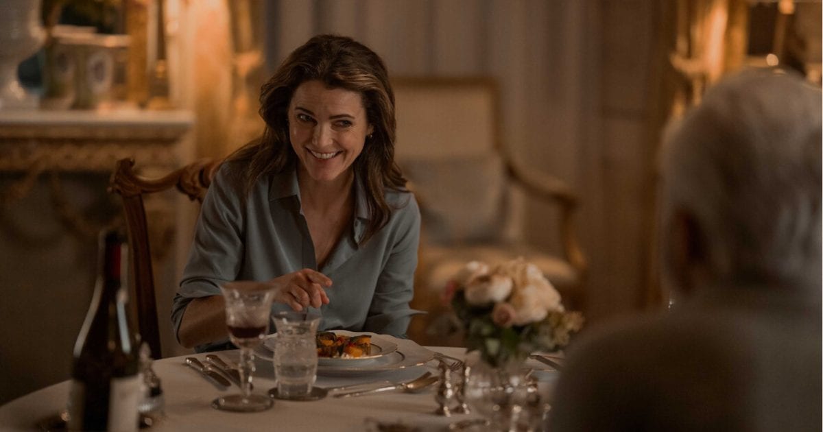 Keri Russell as Kate Wyler happily shares a meal in ‘The Diplomat’ (Image Source: Netflix)