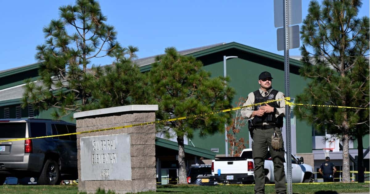Police tape is placed outside Silver Rail Elementary school, where a shooting took place, on Thursday, October 15, 2026, in Bend, Ore (AP Photo/Joe Kline)