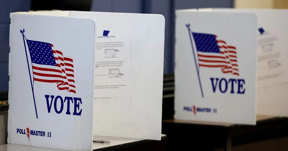 The two holes appear on the back of the envelope, one on each side of the space where voters must sign (Getty Images)