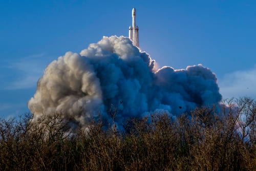 A SpaceX Falcon Heavy rocket launches with NASA’S Nancy Grace Roman Space Telescope onboard from Launch Complex 39A, Sunday, Aug. 30, 2026, at NASA’s Kennedy Space Center in Florida. Roman will investigate dark energy and dark matter, conduct a statistical census of planetary systems, and enable a broad range of additional astrophysics research. Launch occurred at 7:26 a.m. EDT. Photo Credit (NASA/Joel Kowsky)