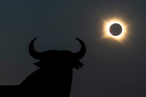 GUADALAJARA, SPAIN - AUGUST 12: A view of the sun behind El Toro Osborne 'The Osborne Bull' during the total solar eclipse on August 12, 2026 in Guadalajara, Spain. It was the first time a total solar eclipse, when the sun is blocked by the moon's orbit, could be viewed from Spain since 1905. (Photo by Pablo Blazquez Dominguez/Getty Images)