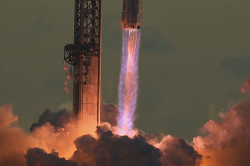 Exhaust from Merlin engines visible as Starship lifts off for a test flight from Starbase, Texas. (Image Source: AP Photo | Eric Gay)