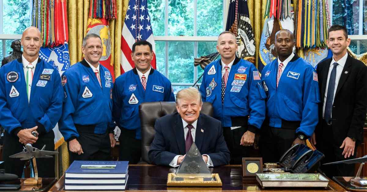 President Donald Trump with NASA Administrator Jared Isaacman and the Artemis III astronauts (in blue). (Cover Image Source: X@WhiteHouse)