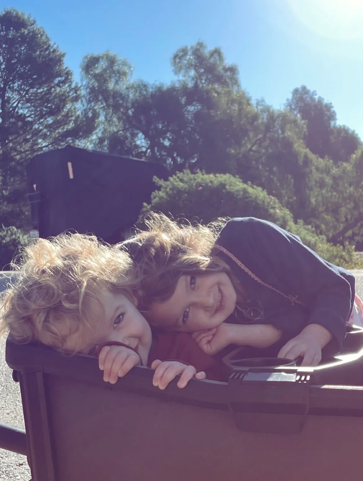 Emerson and Jupiter play together in adorable siblings photo
