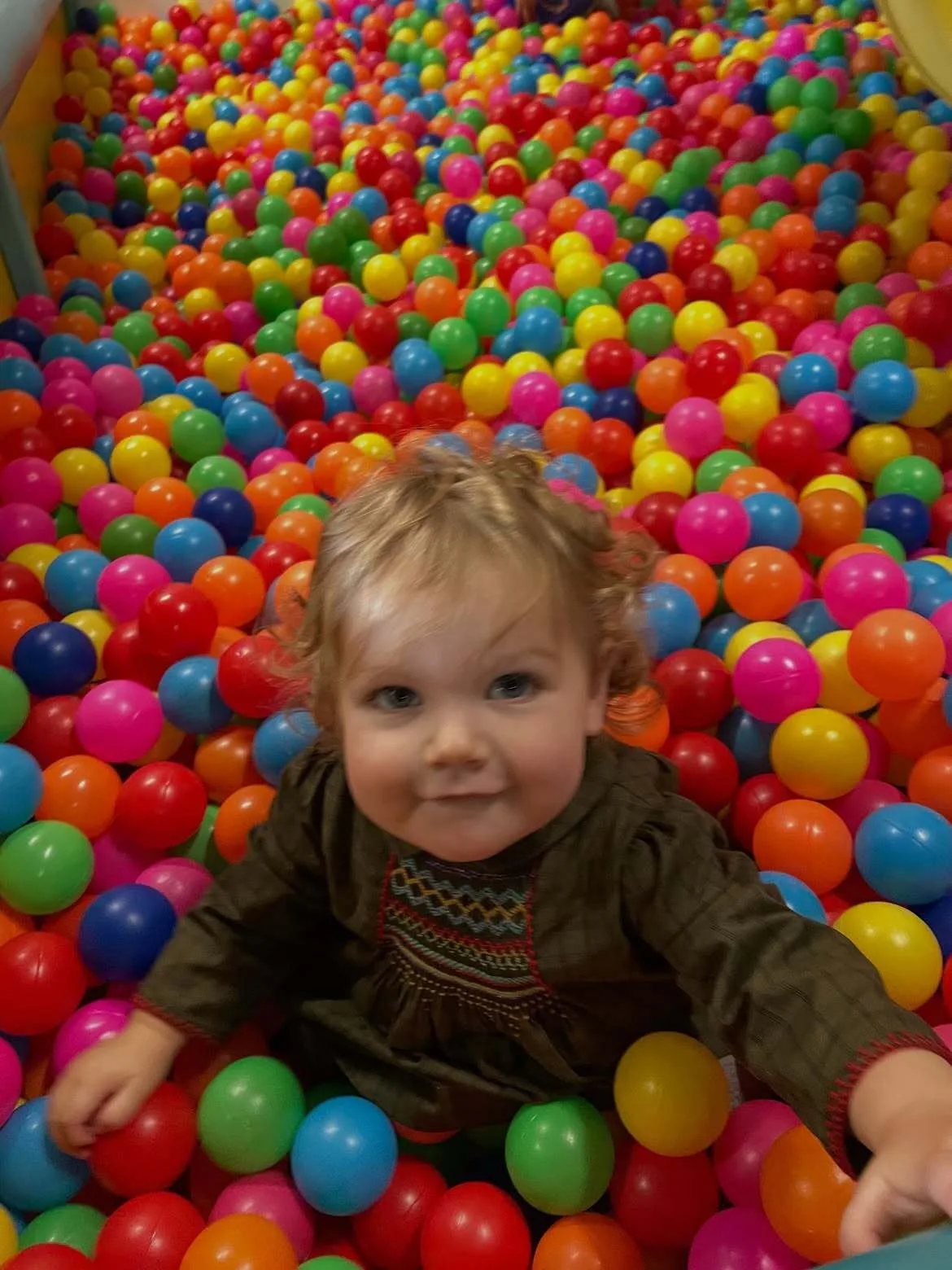 Christopher French shows daughter Emerson playing in a ball pool