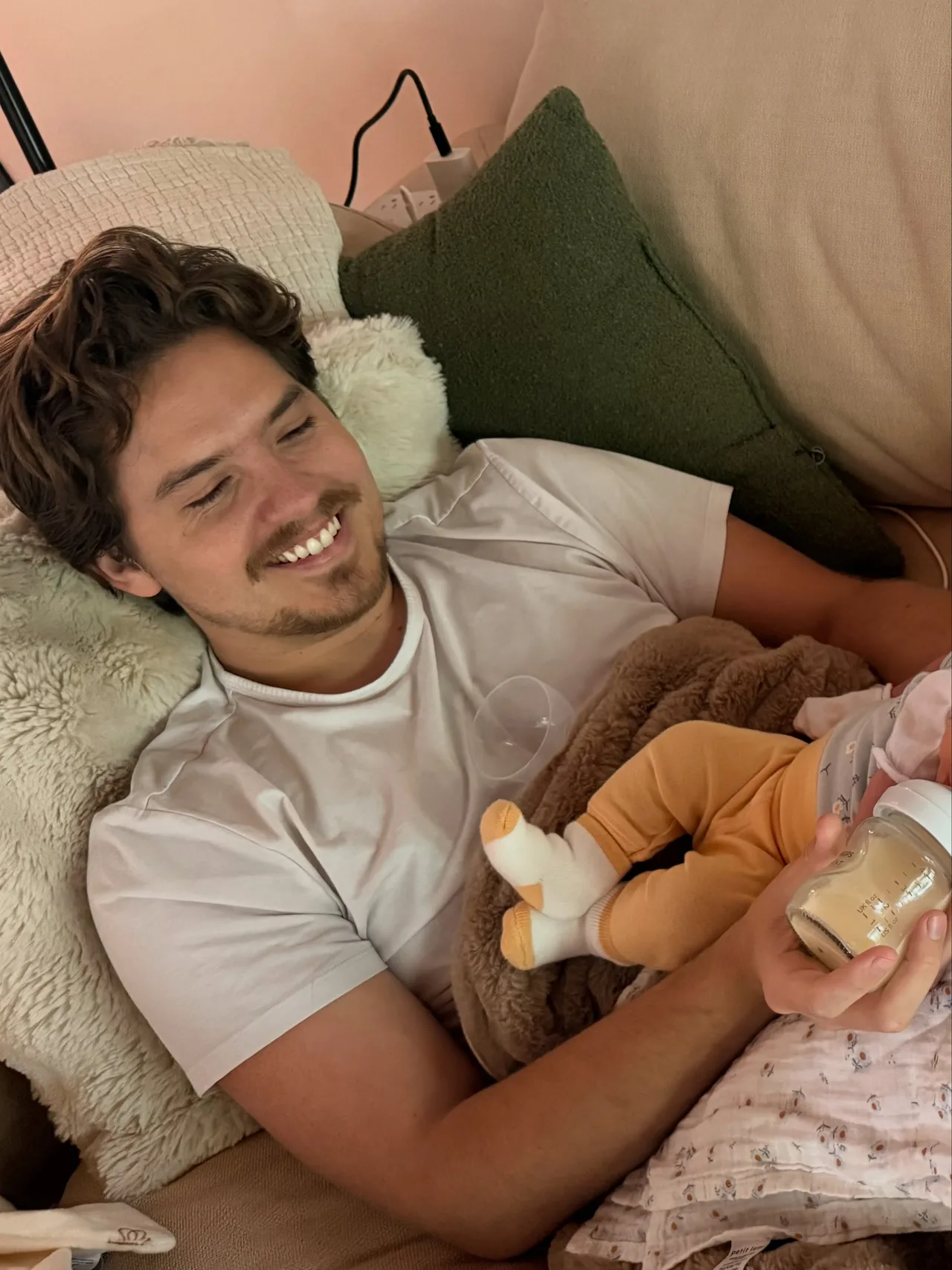 Dylan Sprouse feeds baby Sylvie in adorable photo