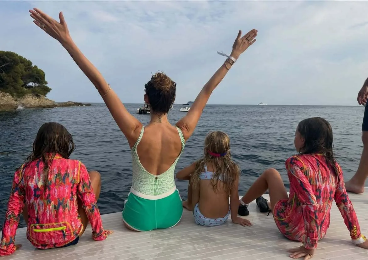 Behati Prinsloo soaks up beach vibes with her children