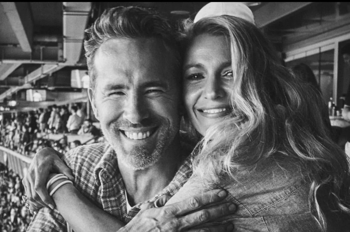 Blake Lively looks ahead with Ryan Reynolds by her side