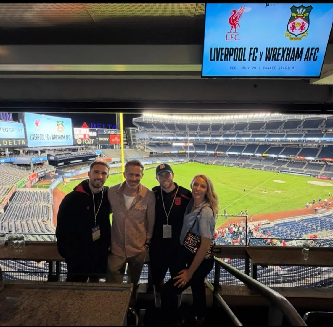 Ryan Reynolds and Blake Lively pose with friends during the match