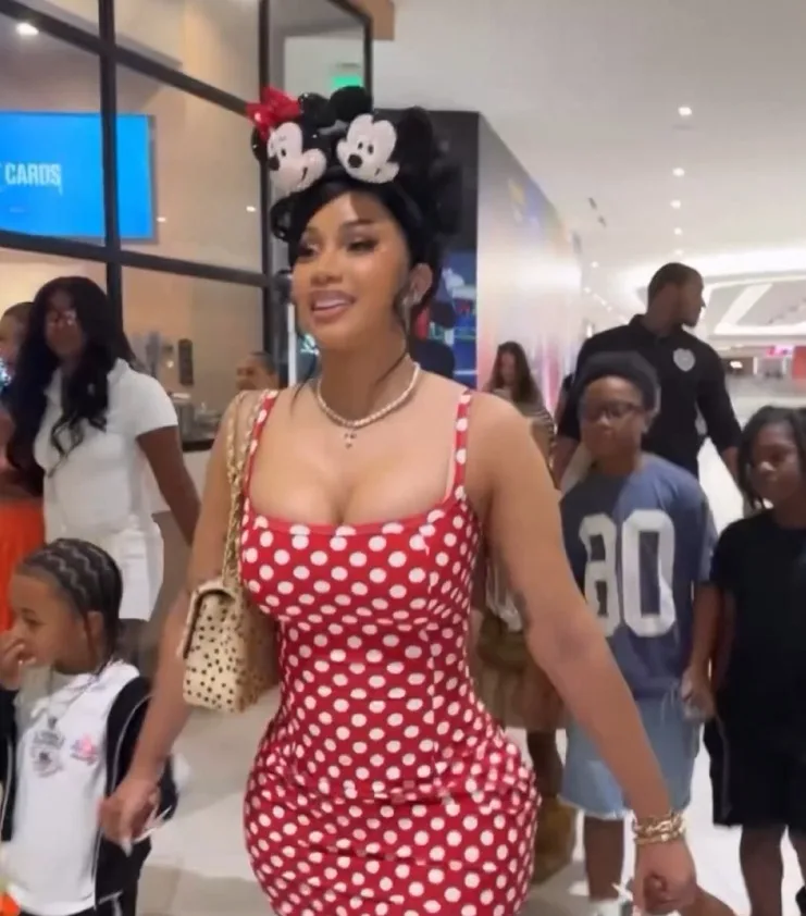 Cardi B holds Wave and Blossom’s hand as she enters their joint birthday bash