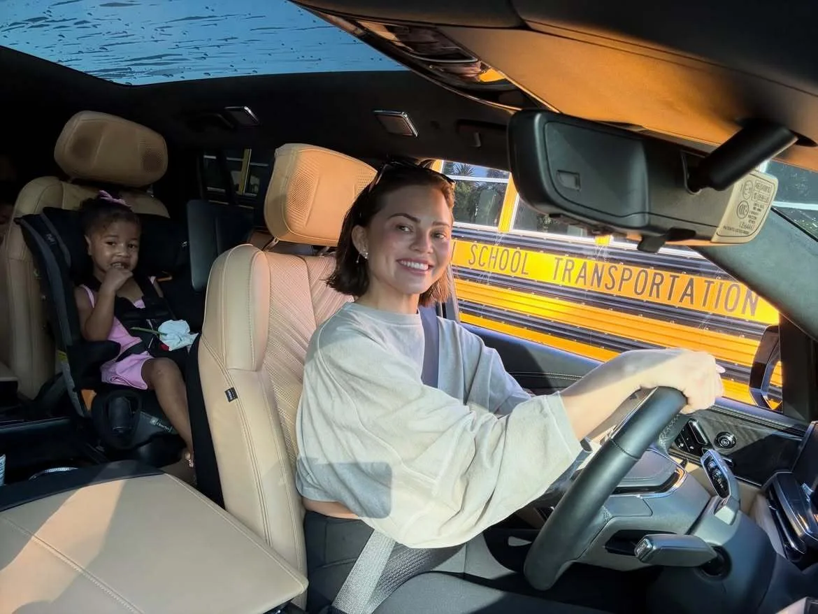Chrissy Teigen drives children to their school