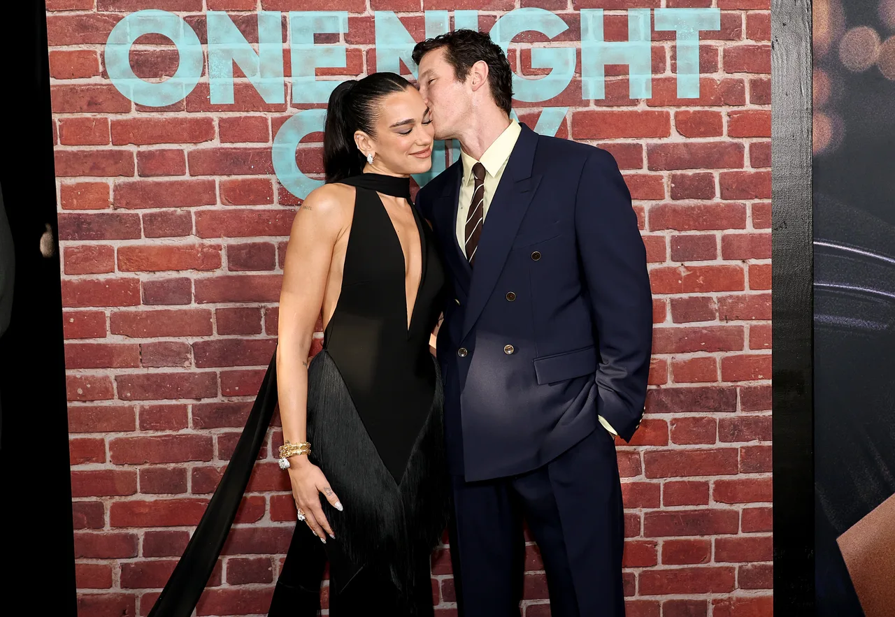 Dua Lipa and Callum Turner packed on the PDA during their red carpet appearance