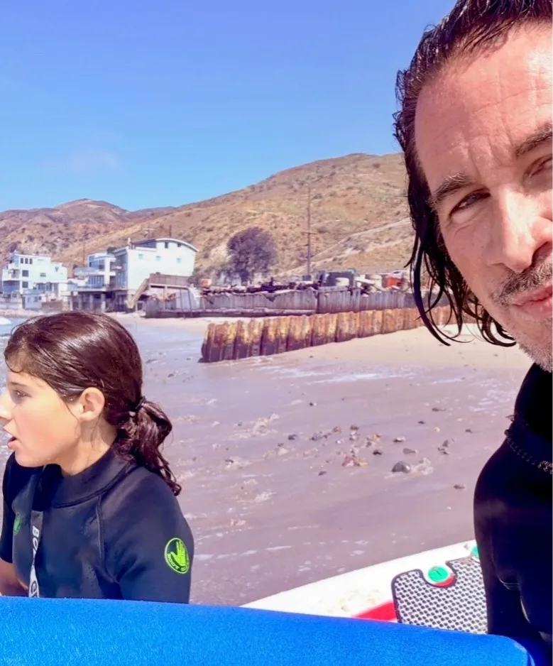 Michael Easton and Lilah Bell bond over their love of surfing
