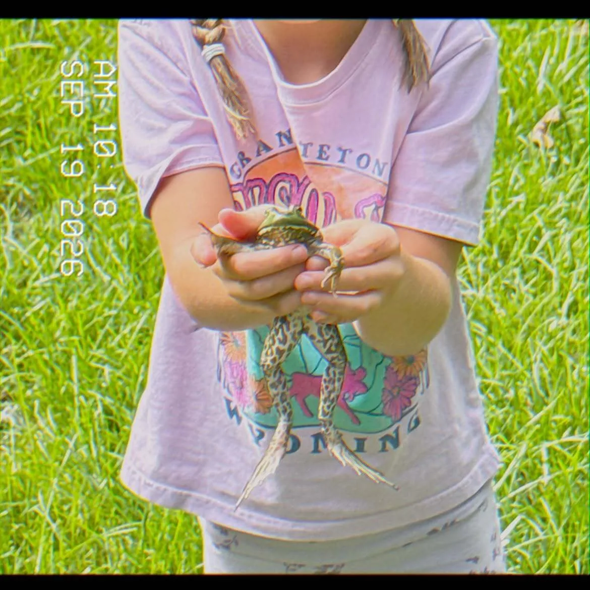 Khai lovingly holds a frog in adorable photo shared by her mom