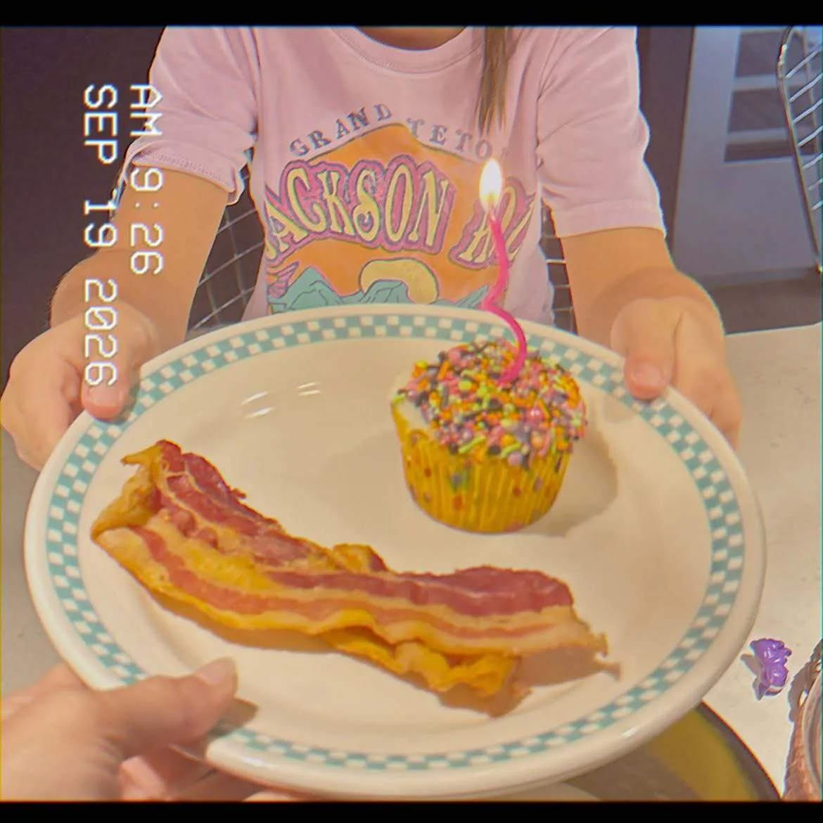 Khai offers cupcake and bacon to mom Gigi Hadid