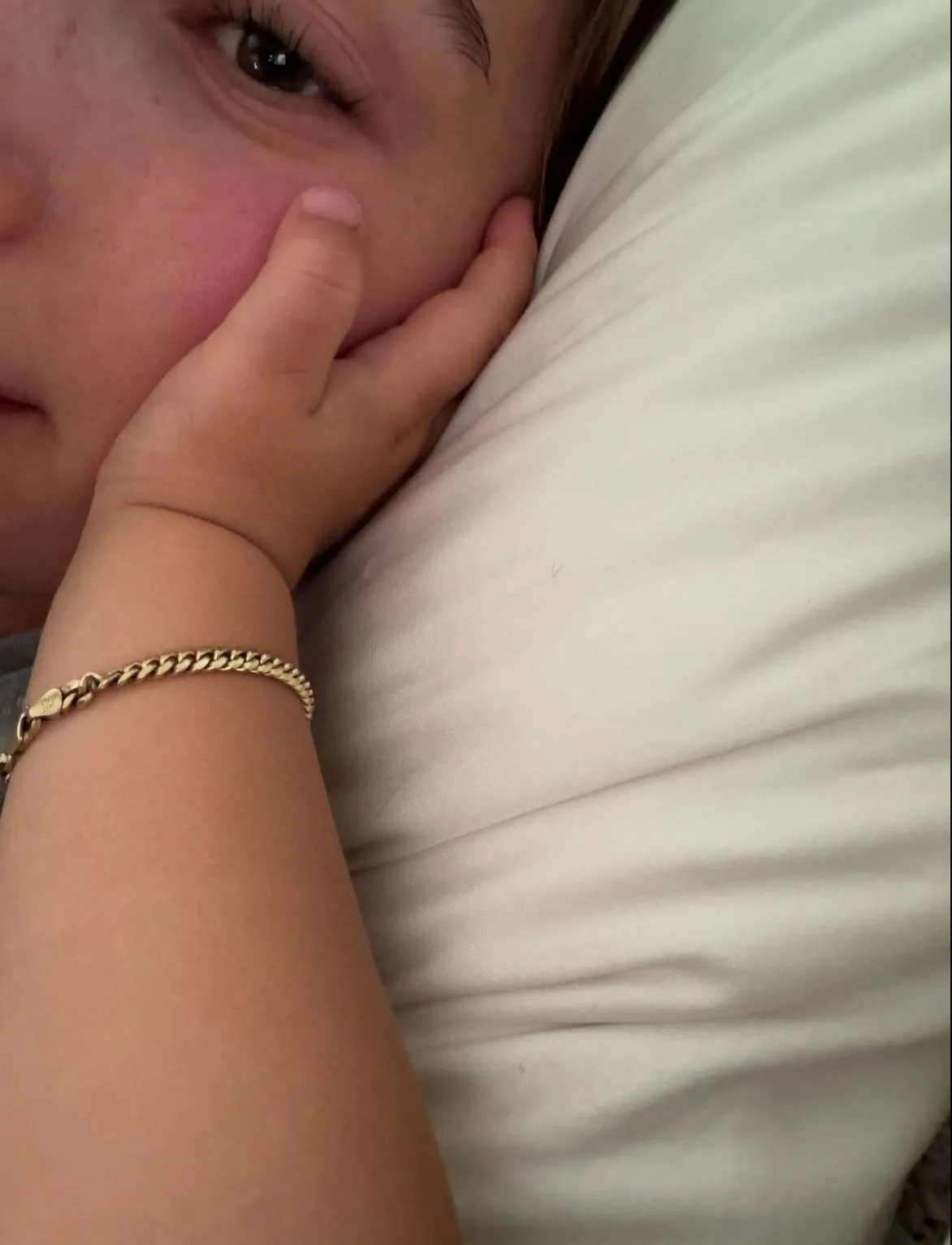 Baby Jack lovingly holds mom Hailey Bieber's face in adorable photo