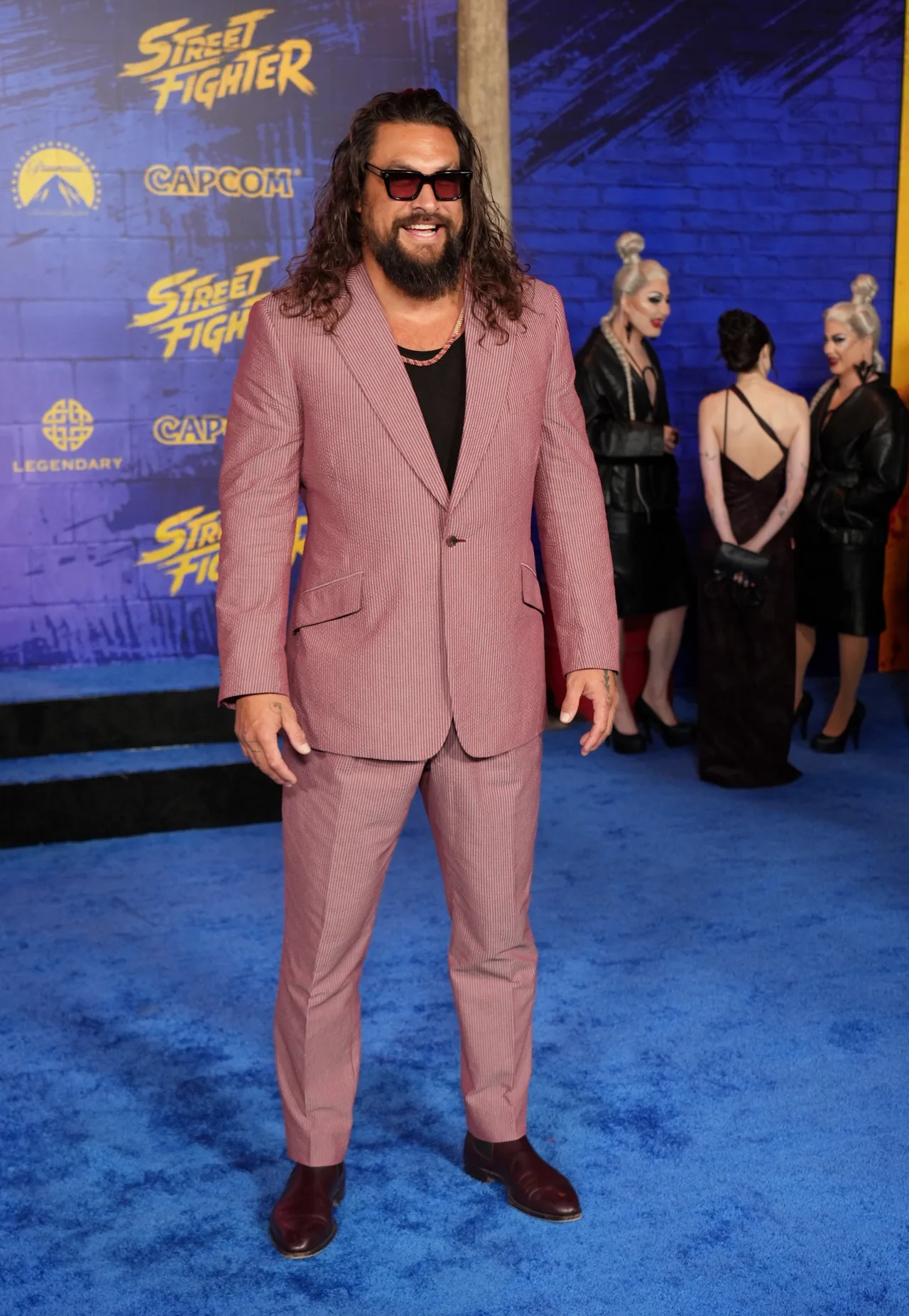Jason Momoa looks dapper in pink suit