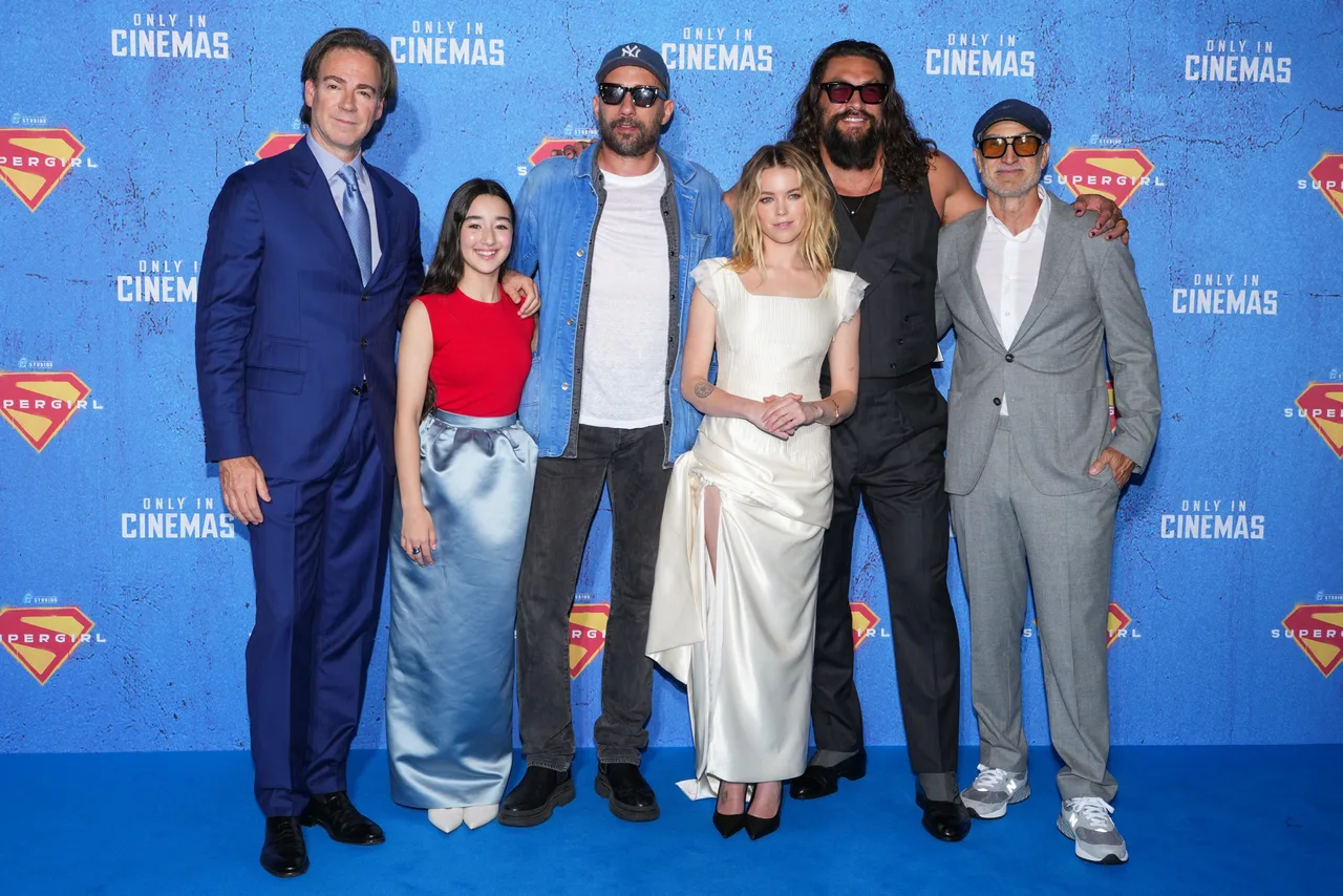 Jason Momoa poses with 'Supergirl' team at the London event