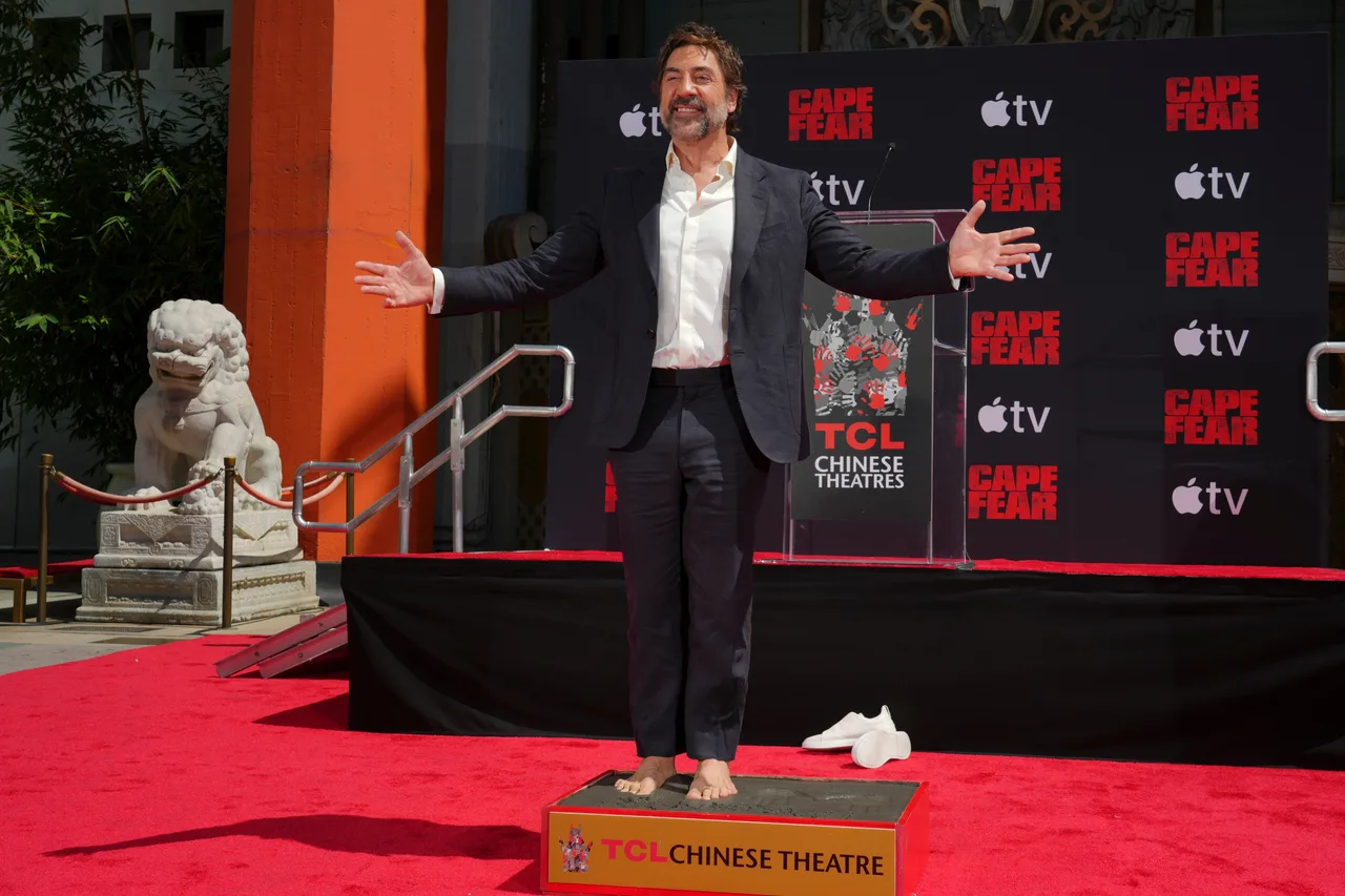 Javier Bardem beams while leaving his footprint outside the TCL Chinese Theatre