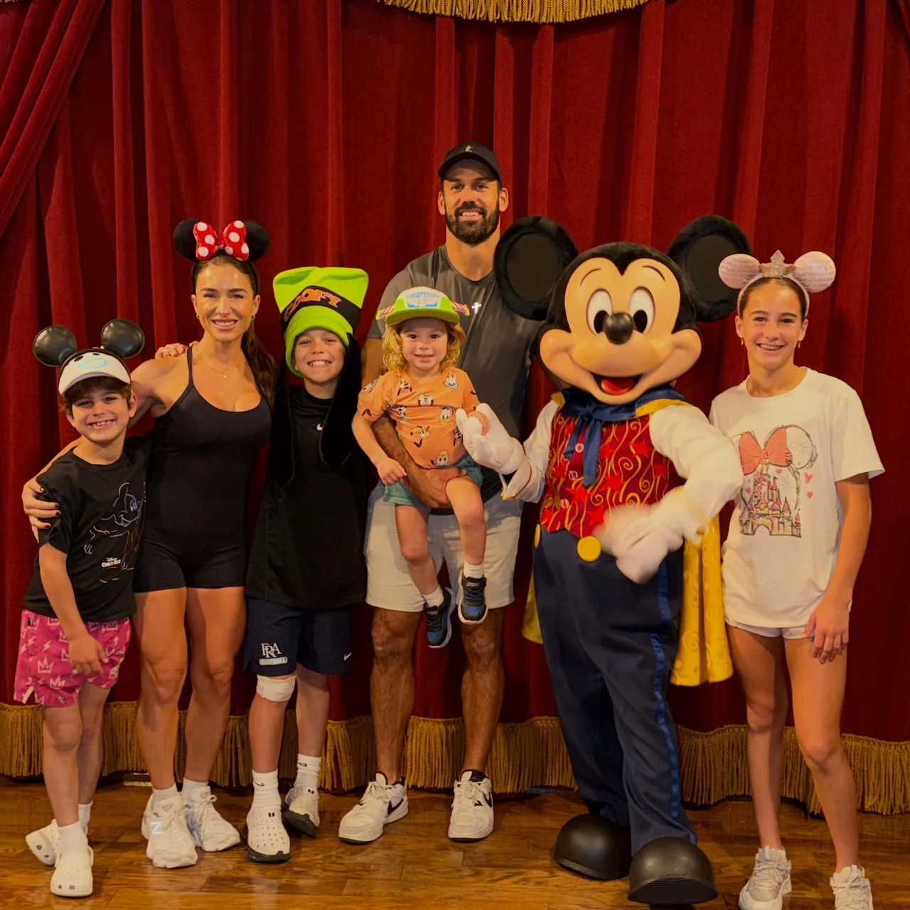 Jessie James Decker and her family pose with Mickey Mouse