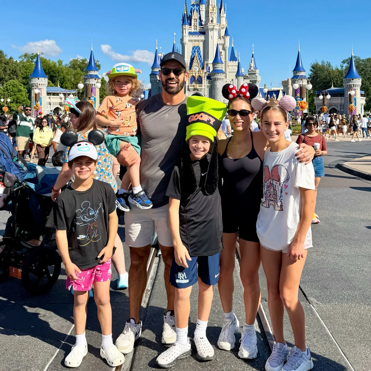 Jessie James Decker and kids pose in front of Cinderella Castle