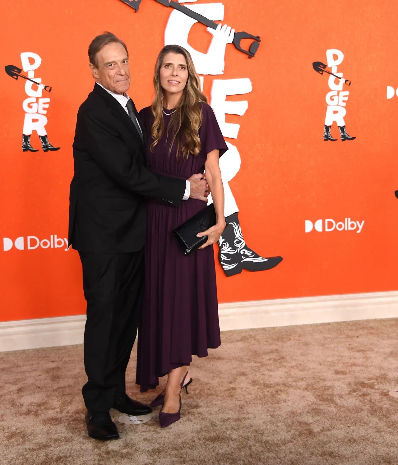 John Goodman keeps it classic while wife Anna Beth stuns in purple gown