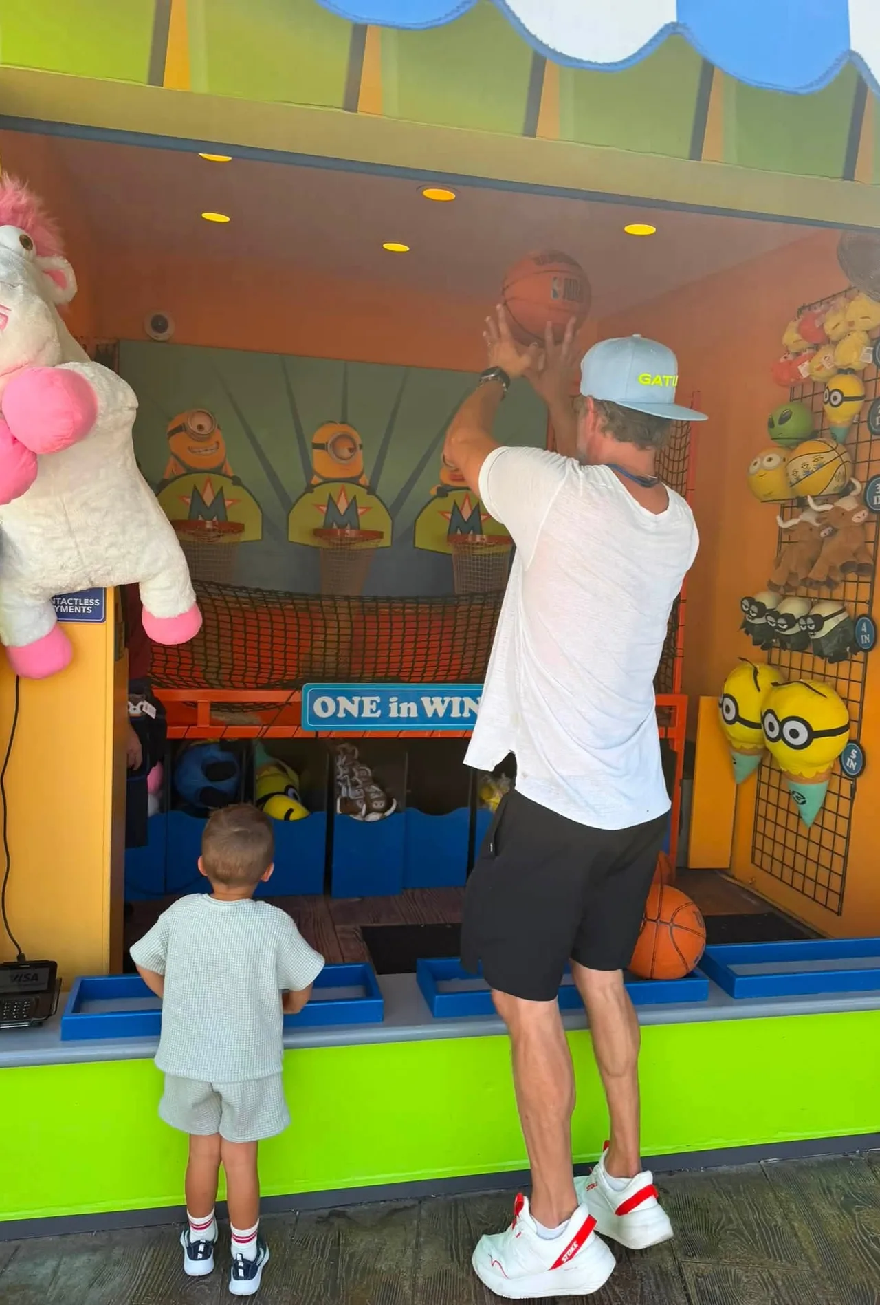 Josh Duhamel shows off his basketball skills with son Shepherd nearby