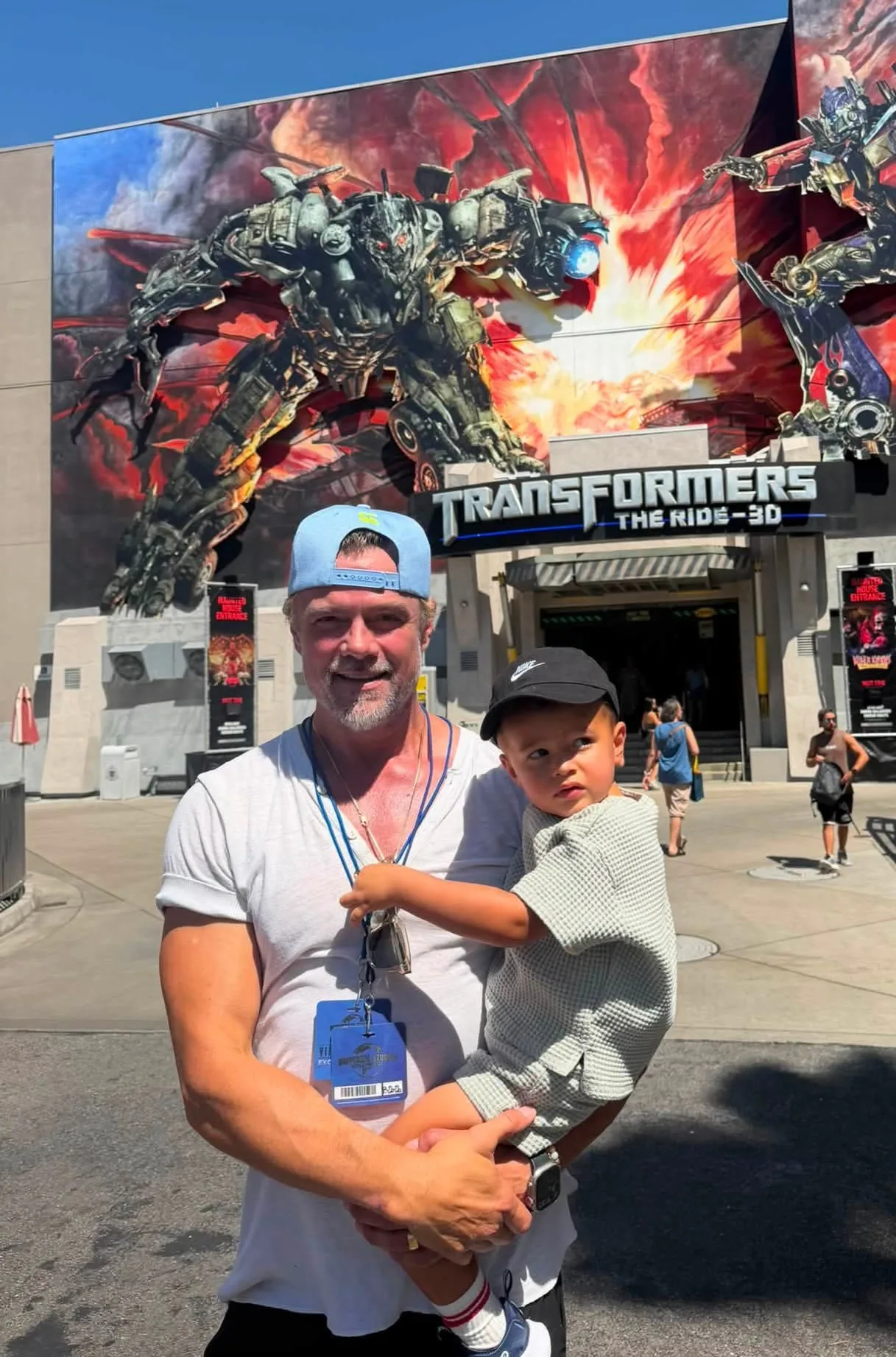 Josh Duhamel poses with son Shepherd outside 'Transformers' ride