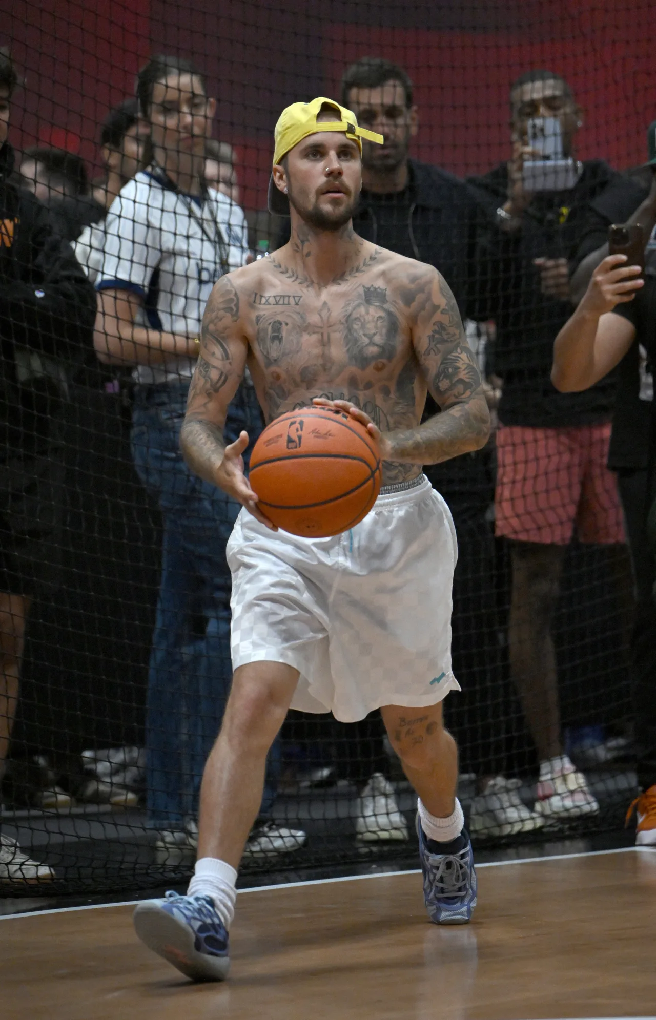Justin Bieber warms up with basketball before taking the Fanatics Fest stage