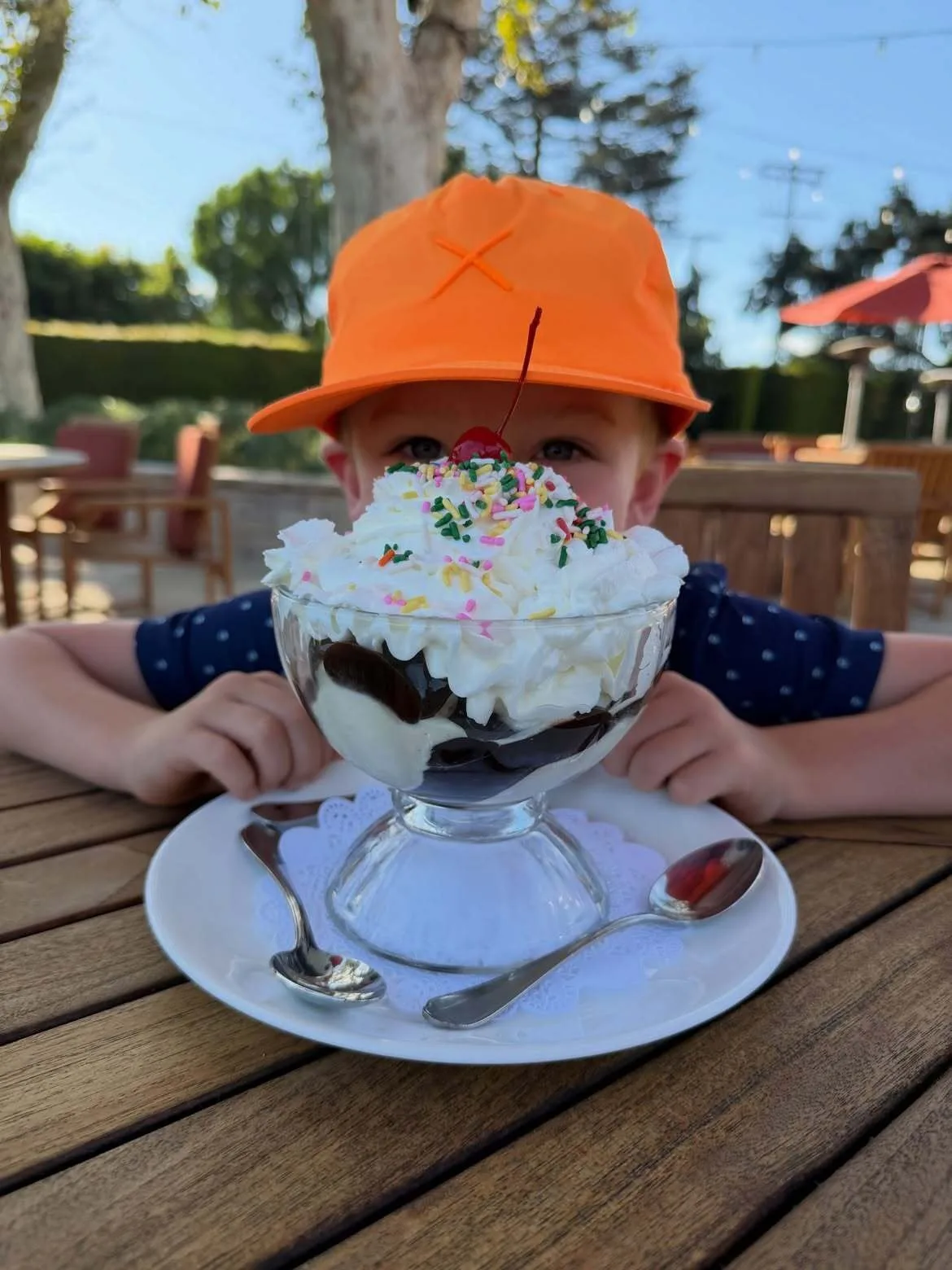 Phineas' eyes glows as he enjoys a massive ice cream sundae