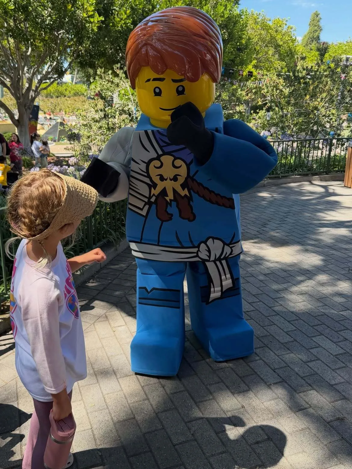 Daisy Dove Bloom interacts with Lego man during birthday trip
