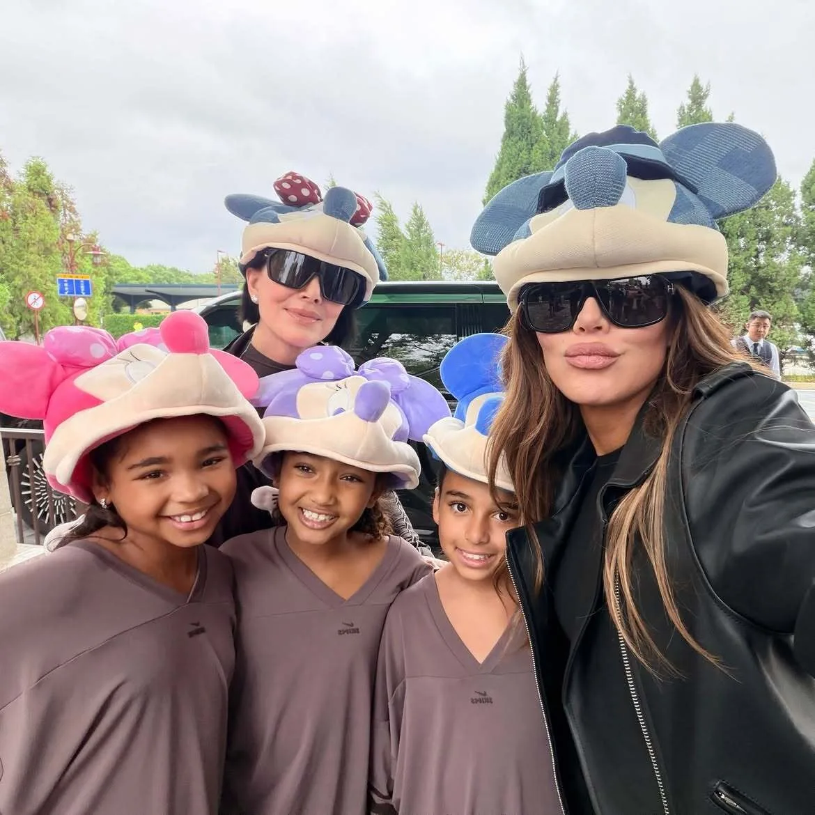 Khloe poses with True and her cousins in matching outfits