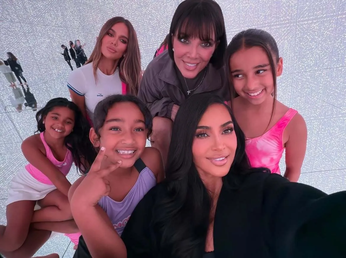 Kim Kardashian poses for selfie with her family