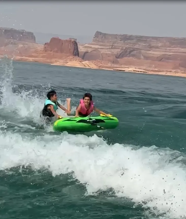 Reign Disick enjoys tubing with a friend