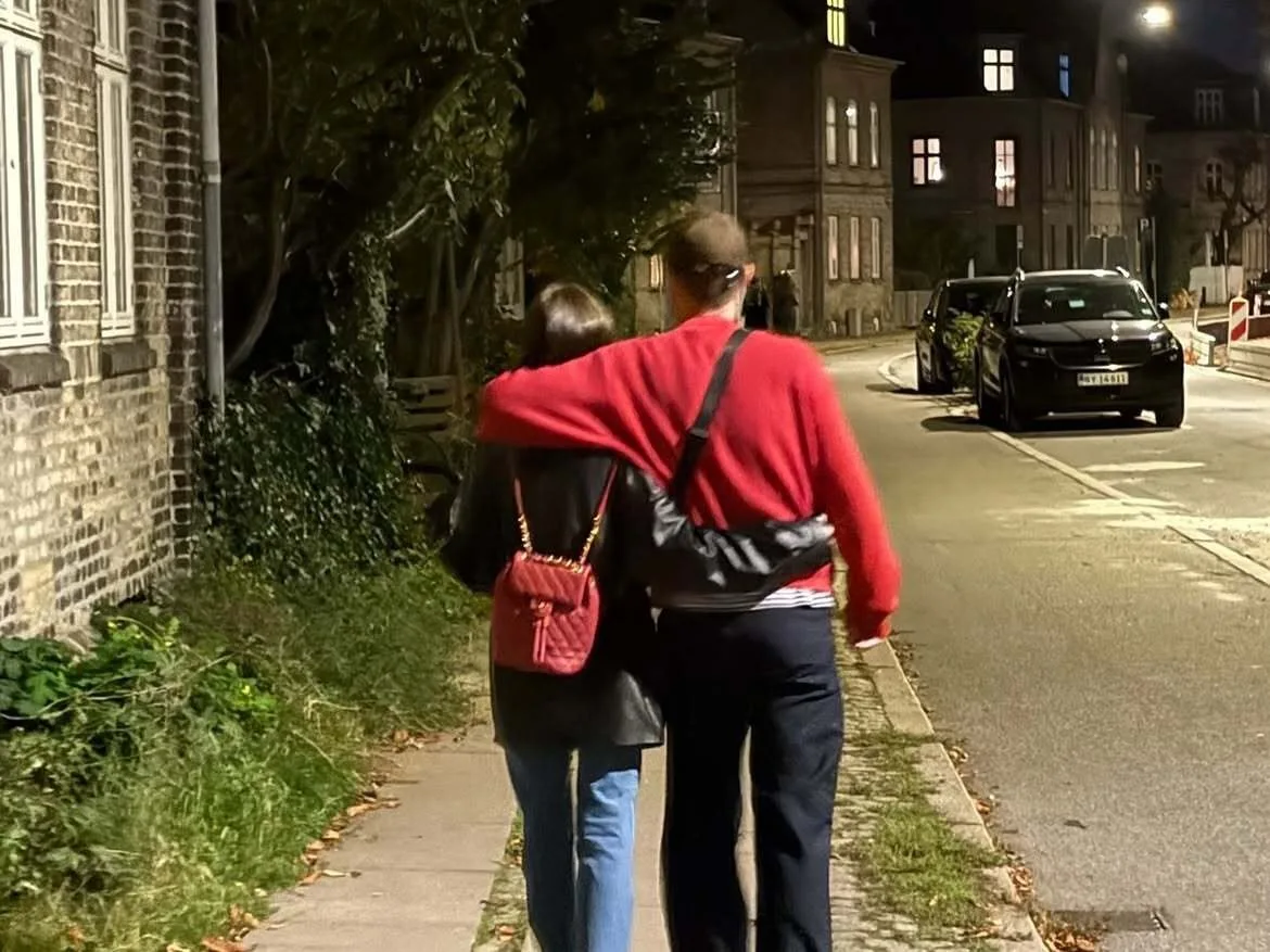 Lily Collins and Charlie McDowell enjoy a romantic stroll down the street