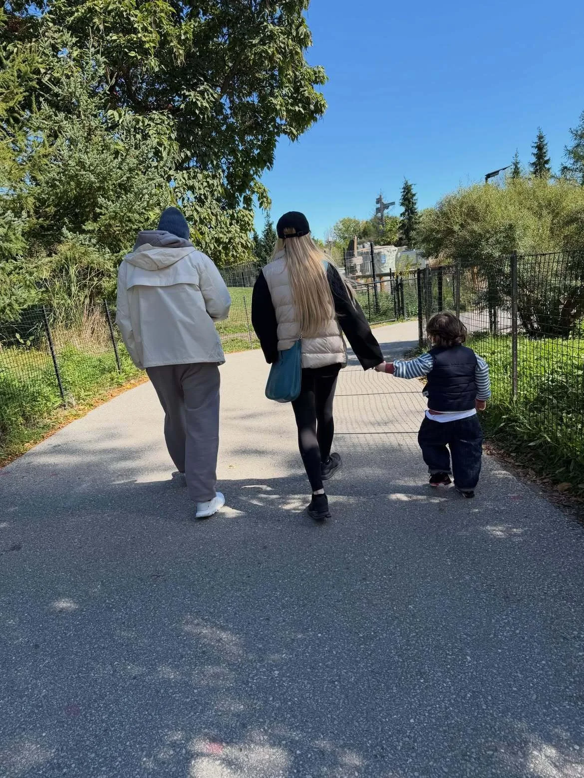 Lindsay Lohan enjoys a sunny stroll with husband and son