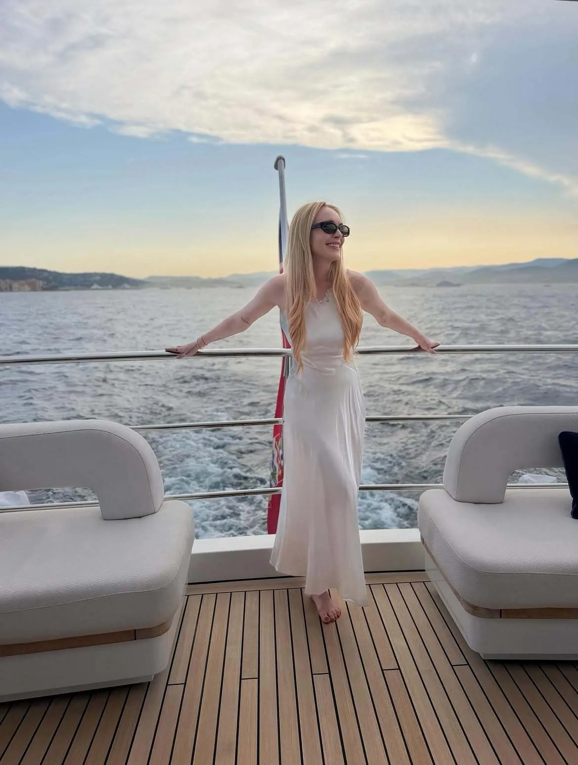 Lindsay Lohan poses on luxury yacht while enjoying scenic family trip