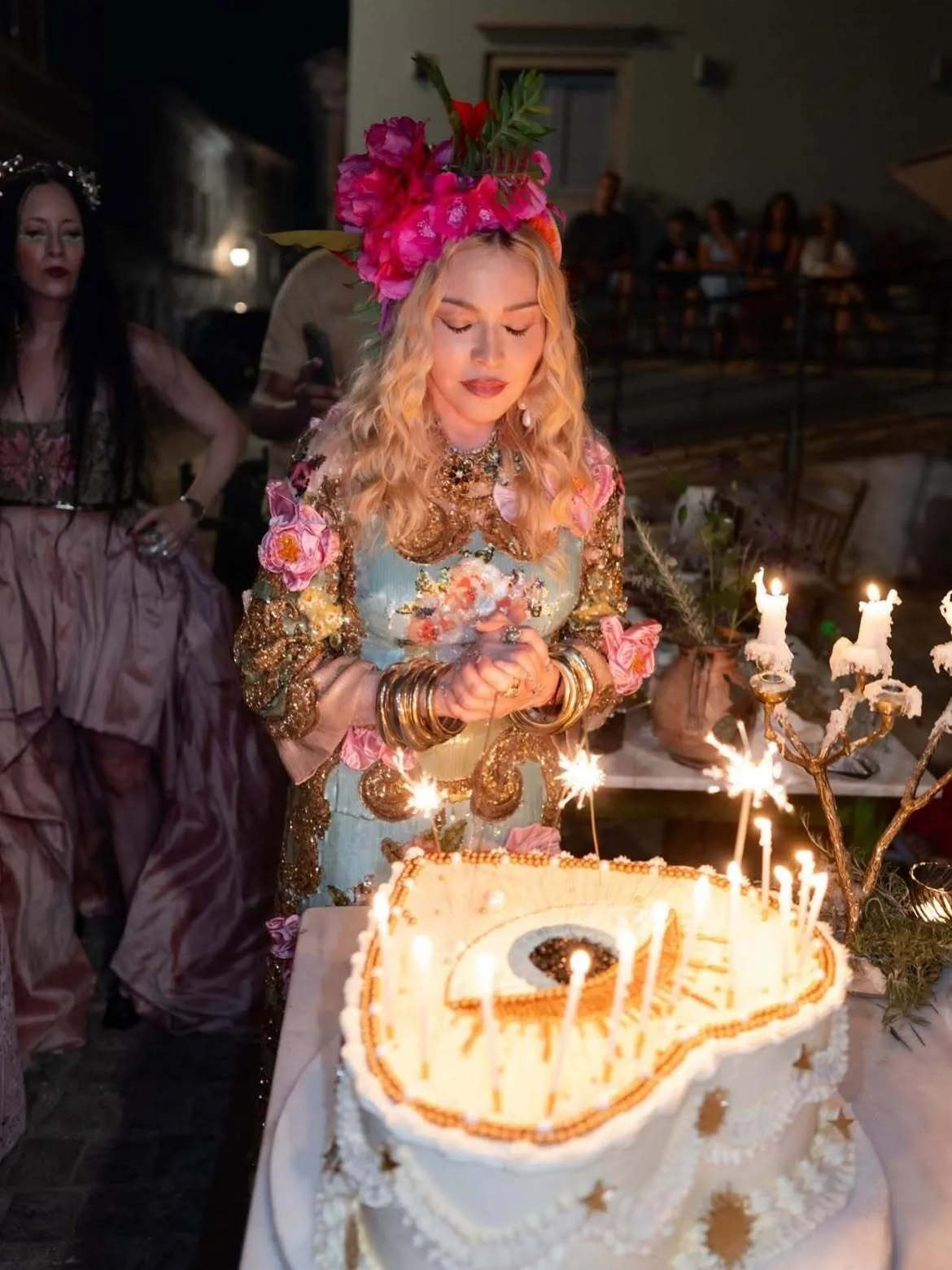 Madonna makes a wish in front of huge heart-shaped cake for 68th birthday