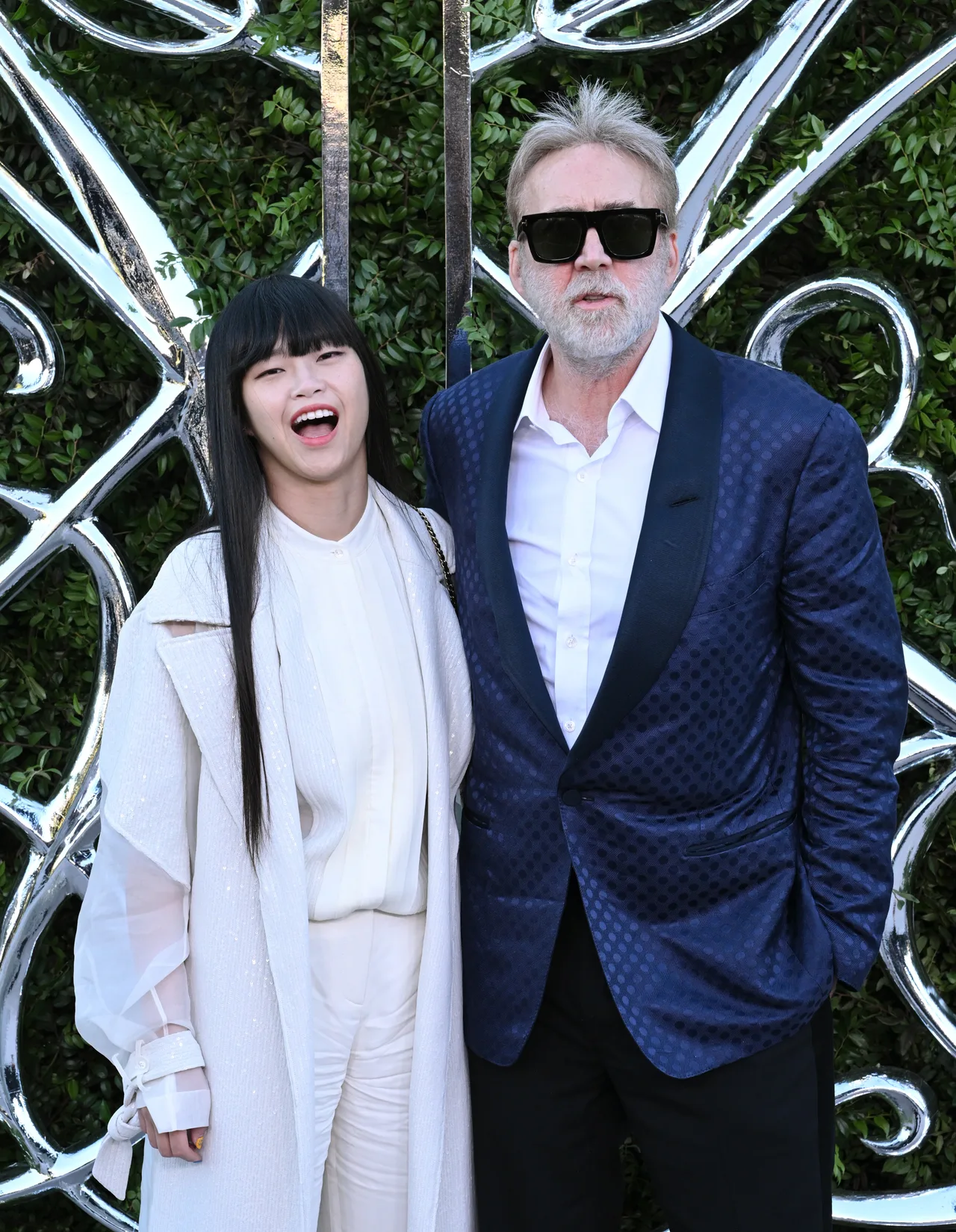Nicolas Cage keeps much younger wife Riko Shibata close at the red carpet
