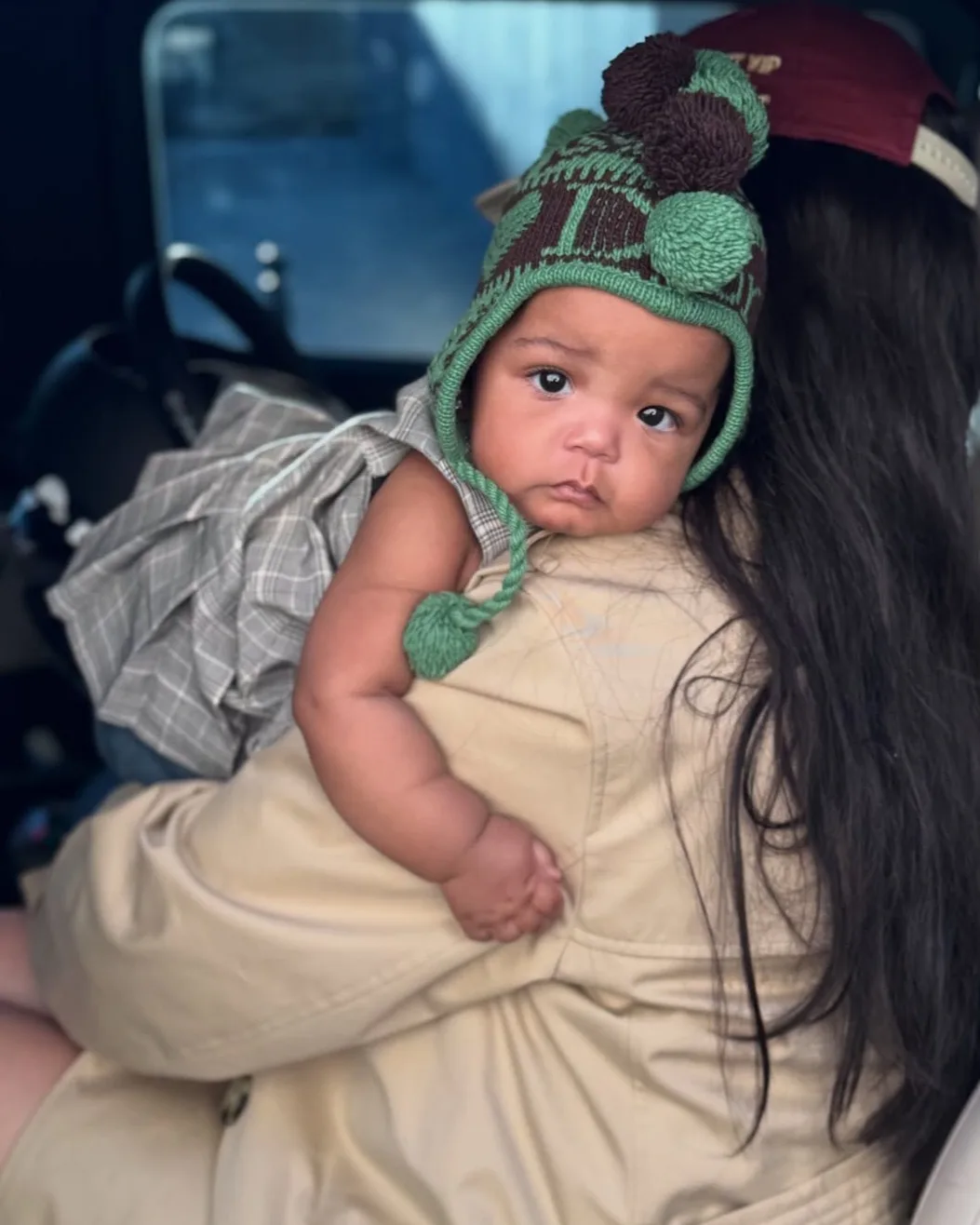 Rocki holds on to mom Rihanna as they step outdoors