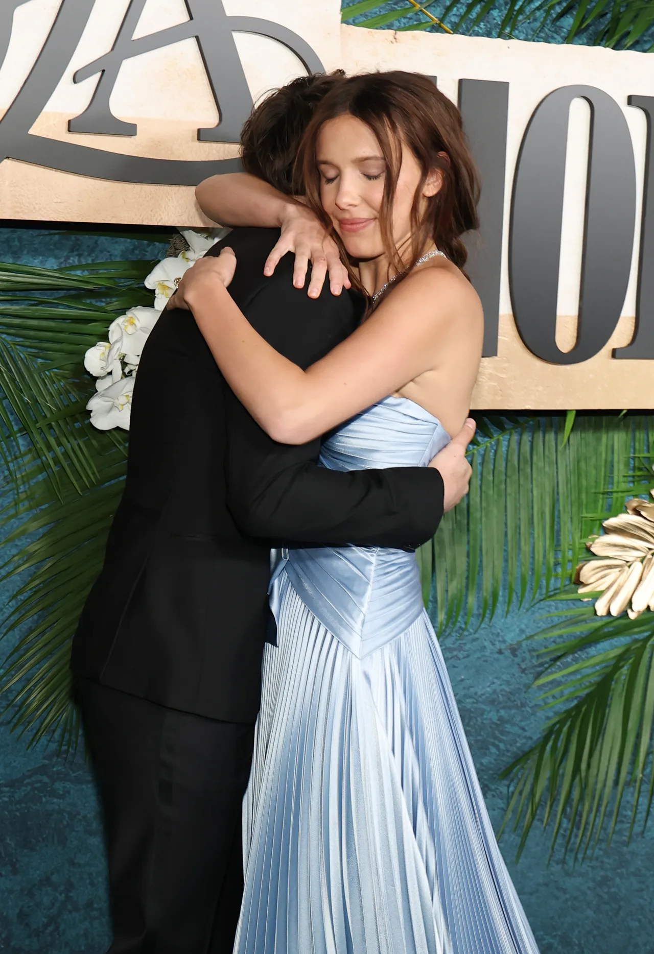 Millie Bobby Brown lights up as Noah Schnapp supports her at 'Enola Holmes 3' event