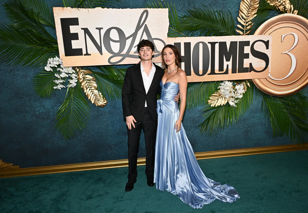 Millie Bobby Brown turns heads in custom Galia Lahav while Noah Schnapp embraces classic suiting