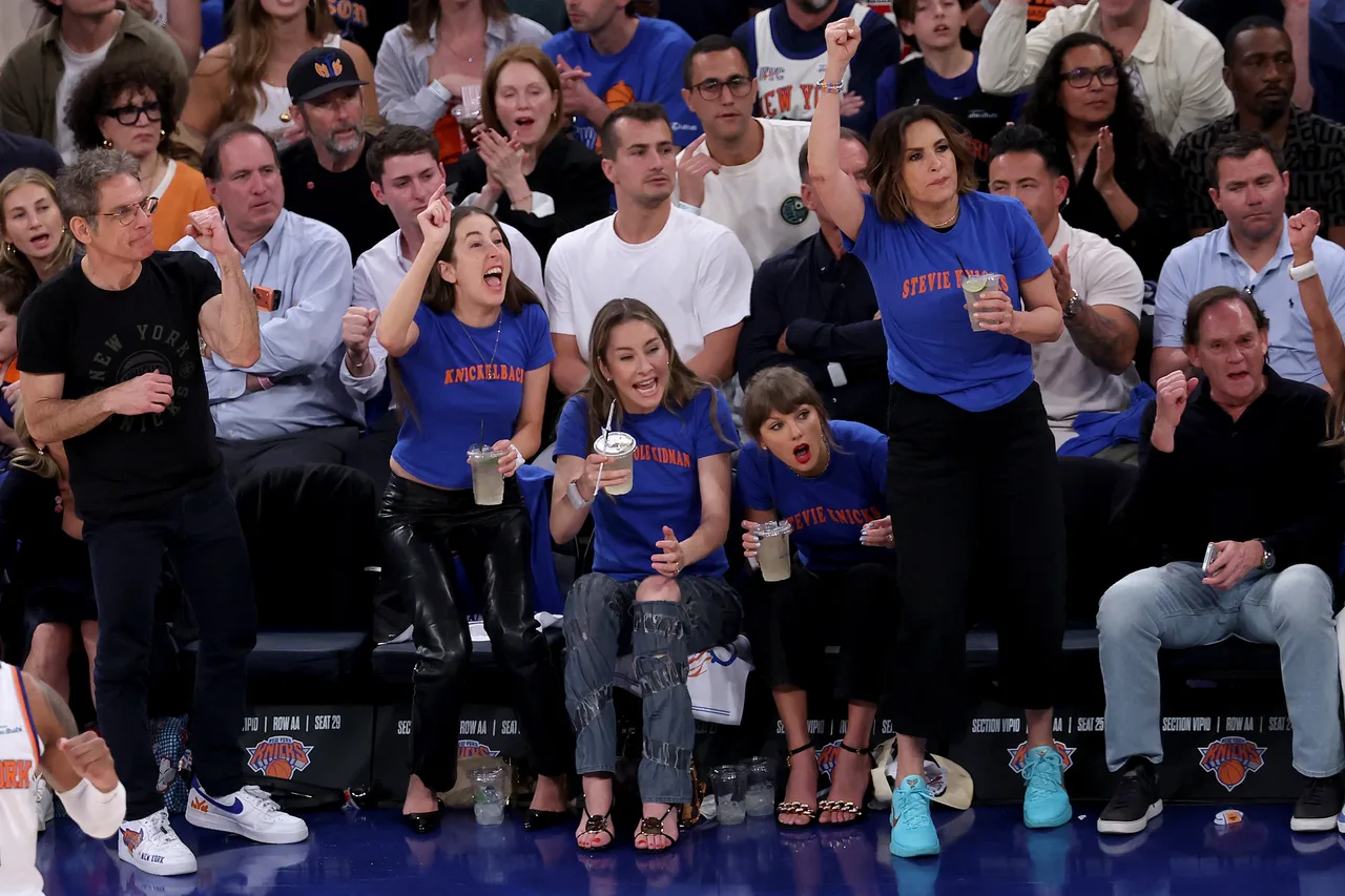 Taylor Swift's friends Alana Haim and Este Haim join her wearing similar merch