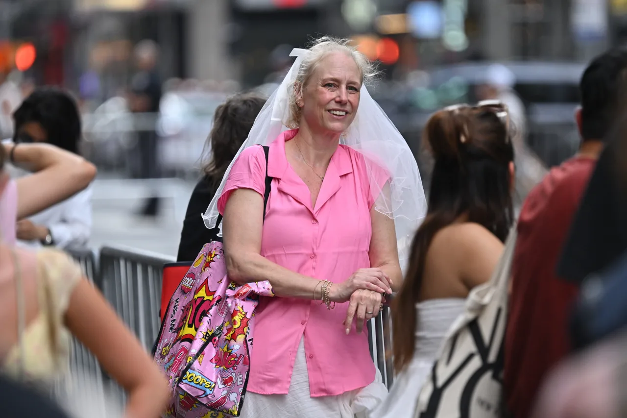 Bride-inspired fan awaits Taylor Swift and Travis Kelce's big moment