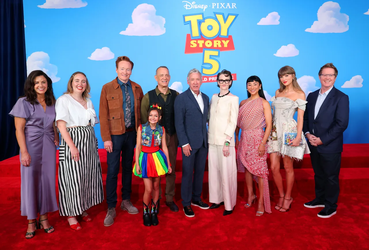 Taylor Swift poses with 'Toy Story 5' family