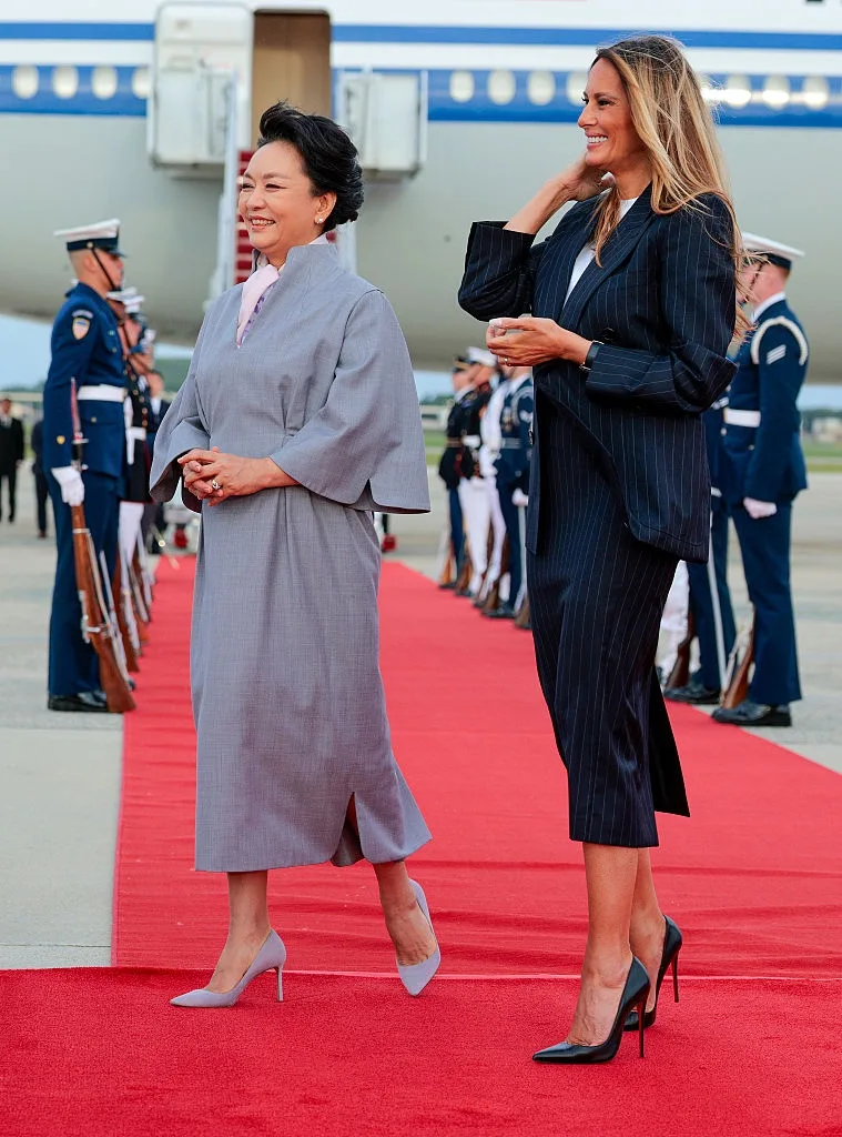 Melania welcomes Xi in a fitted Givenchy skirt suit
