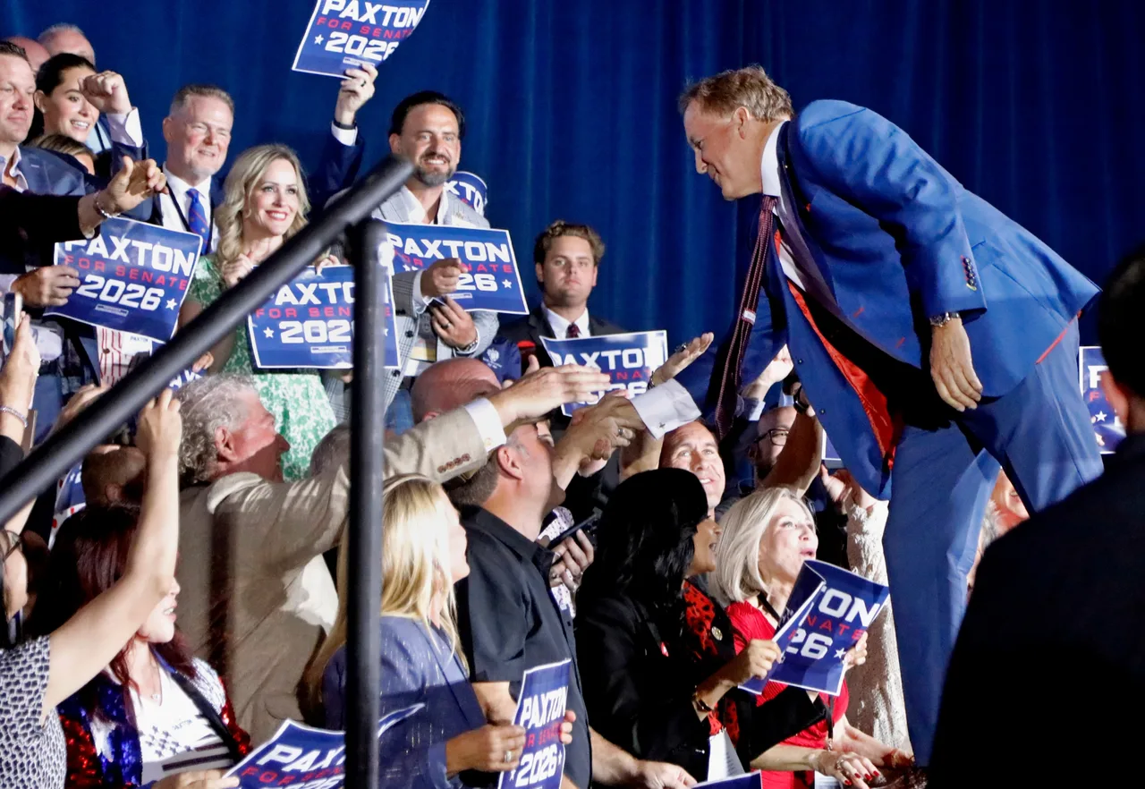 Victor Ken Paxton greets his supporters